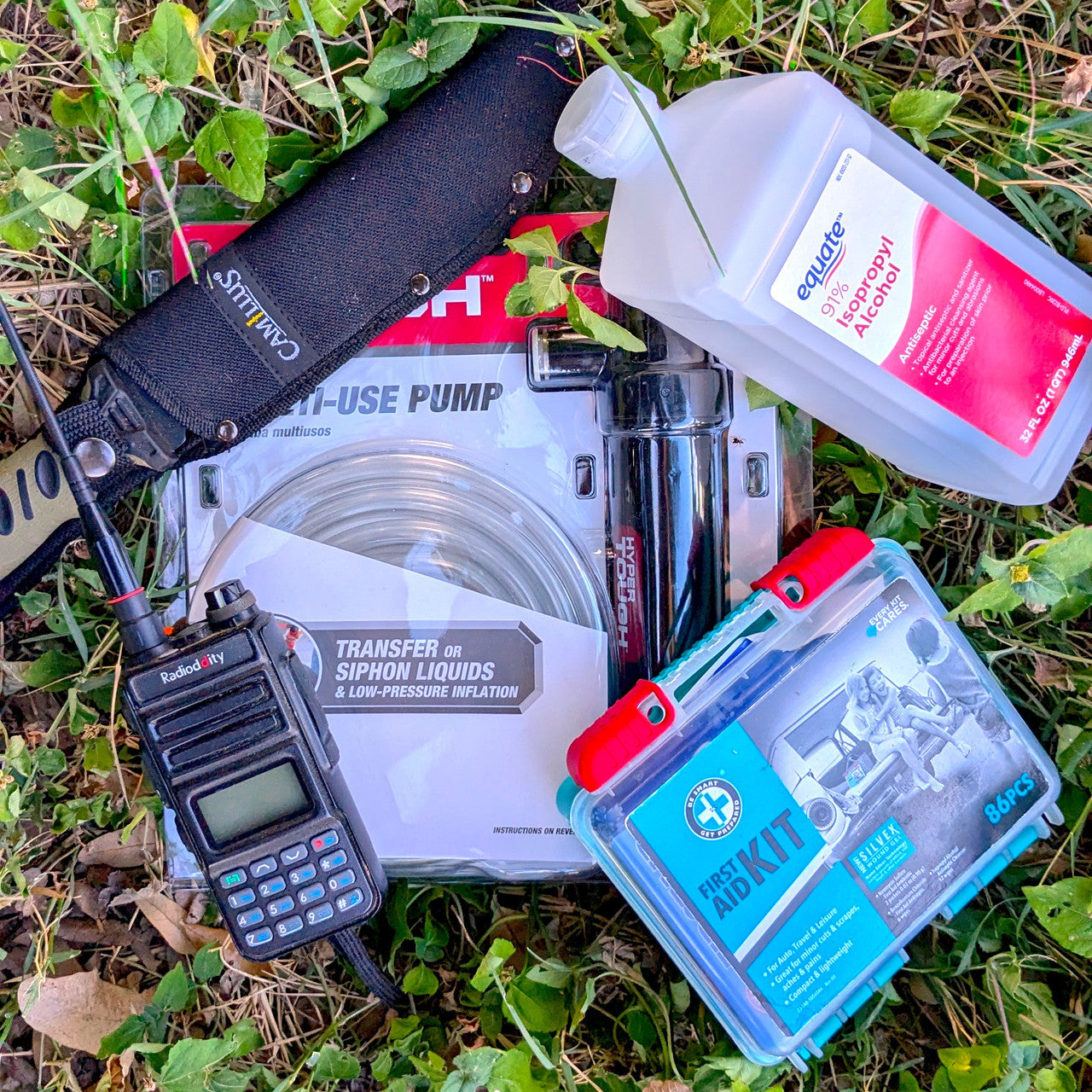 Some of the items necessary for preparedness - a knife, first aid, siphon pump, and rubbing alcohol.