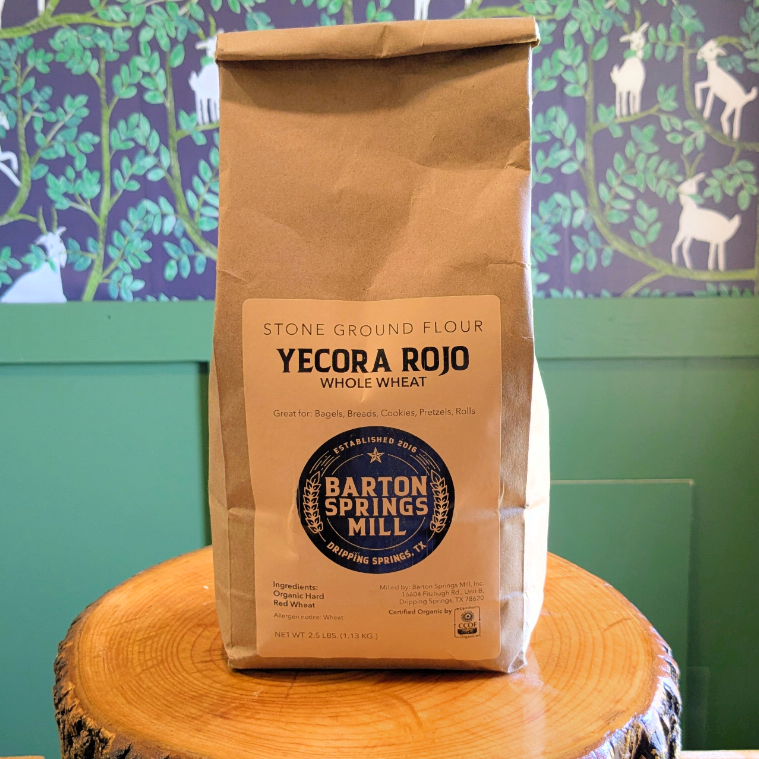 A bag of Yecora Rojo bread flour on a wooden crate